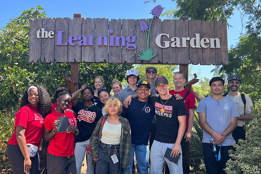 students in front of The Learning Garden