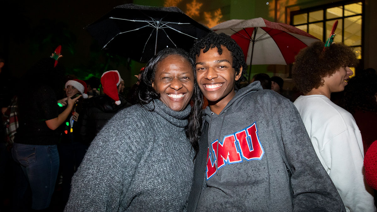 A student and their parent smiling together