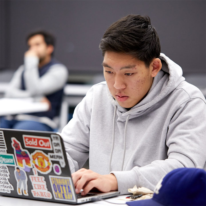 Student using a laptop in class