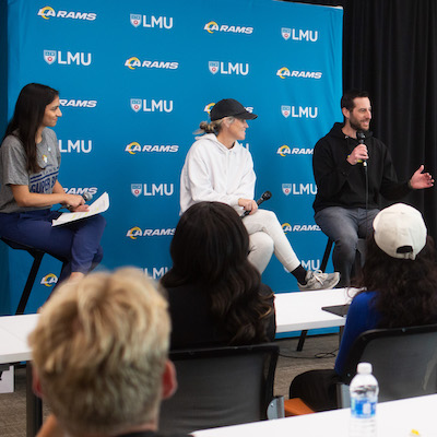 Students watch panel discussion at Rams headquarters