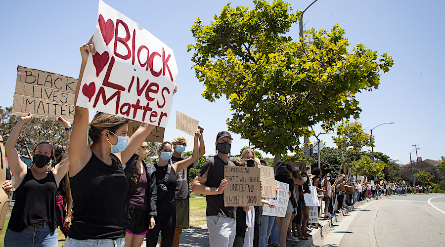 people holding signs at Black Lives Matter demonstration